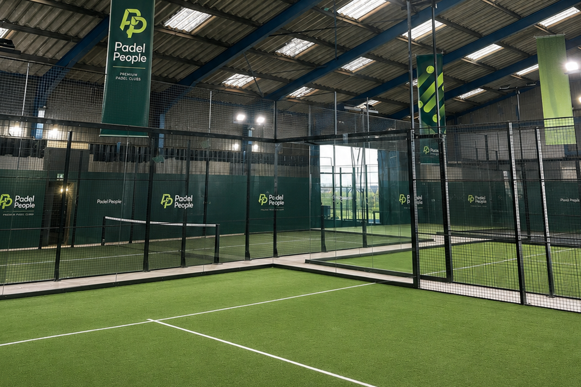 Indoor padel courts with green artificial turf and mesh fencing in Hull