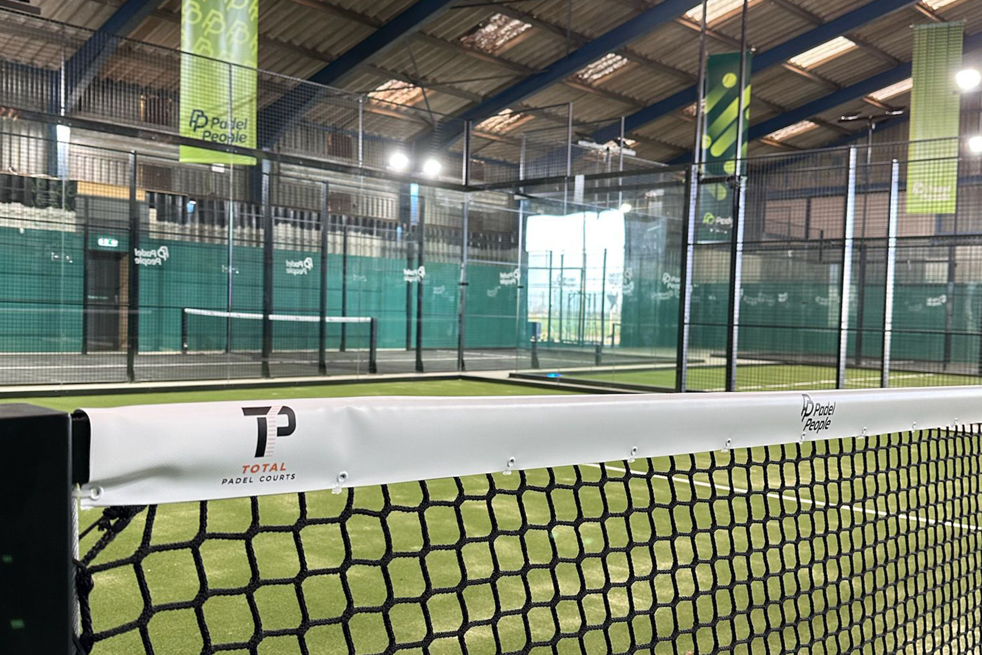 Close-up of a padel court net and post with green surround in Boston, Lincolnshire