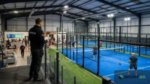 Are padel courts profitable, a busy indoor padel club in the UK built by SportBS with courts booked in the evening.