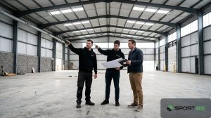 How much does it cost to start a padel business, SportBS team measuring an empty warehouse in the UK with an investor.